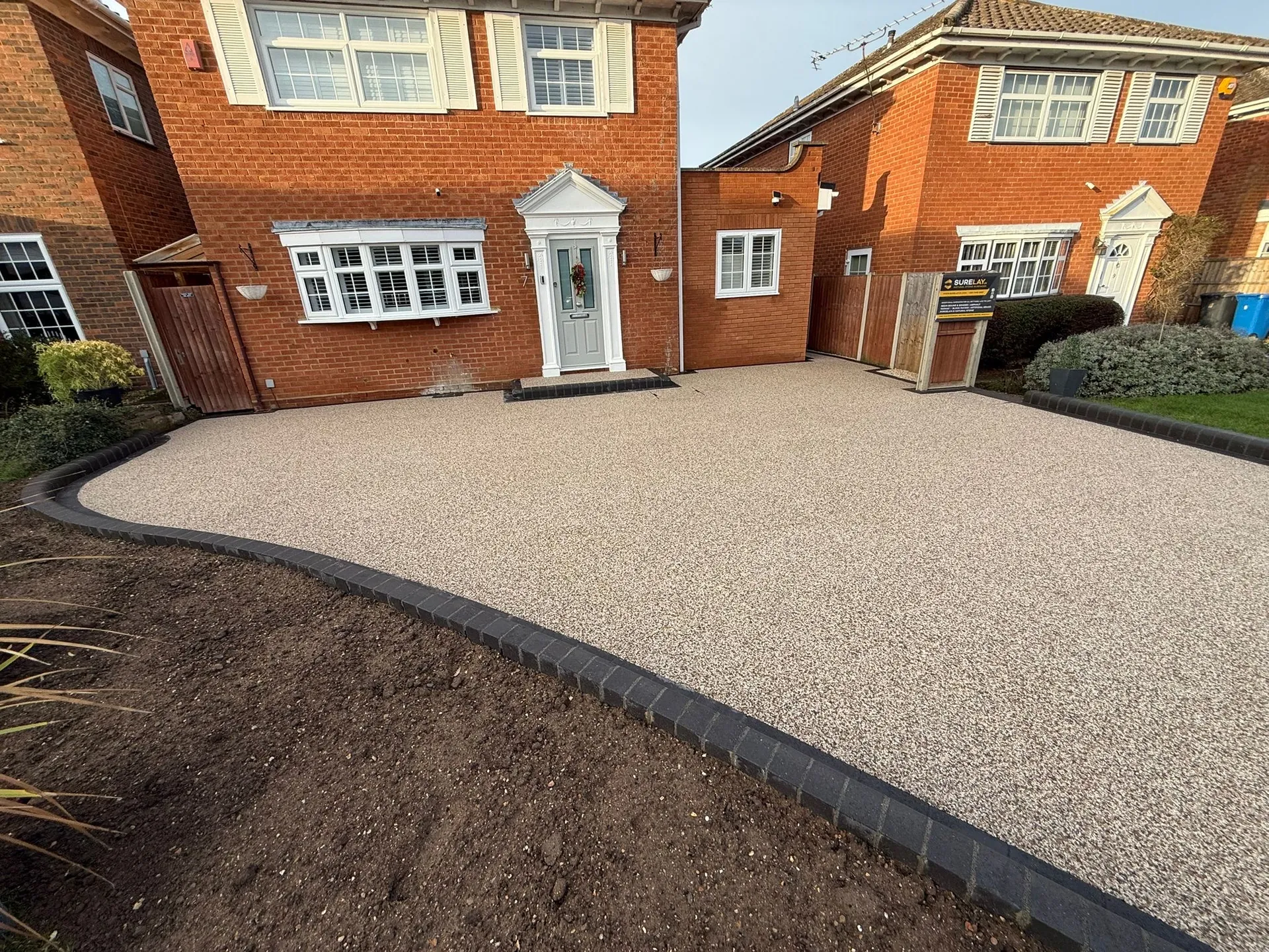 Red Brick Detached Property resin bound driveway by SureLay UK in Windsor, Berkshire